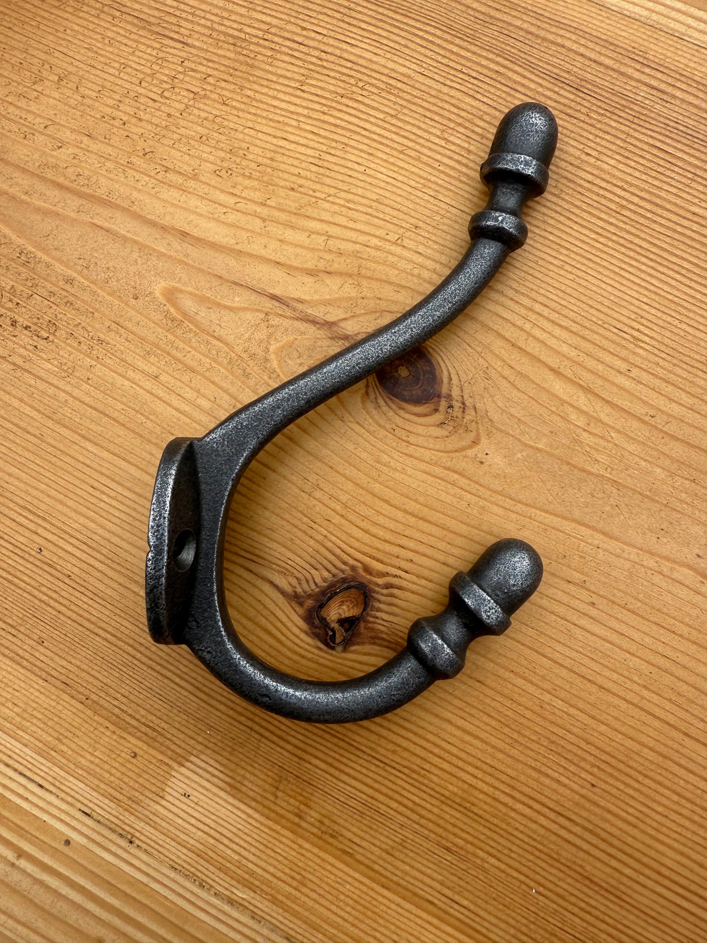 Wall mounted Oak Coat Rack with Antique Style Cast Iron Hooks with Acorn head detail.